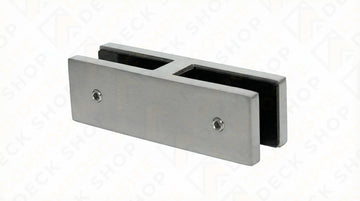 Rectangular metal glass clamp with two screw holes for securing frameless glass railing or connecting 180° glass panels.