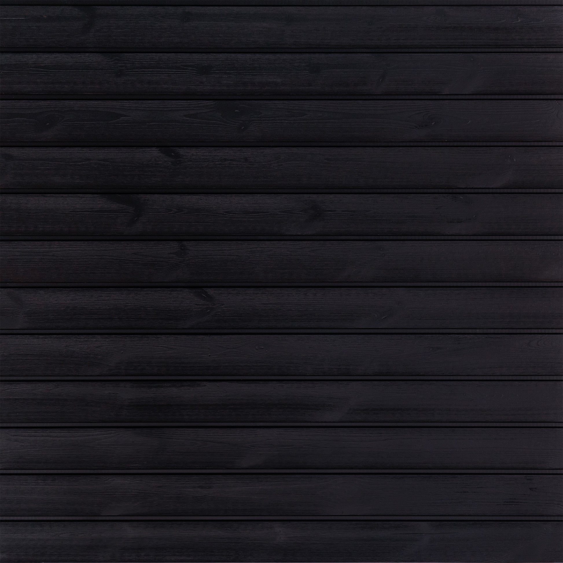 The Lunawood - Luna Pro panel by Lunawood showcases horizontal planks of dark, heat-treated wood with a smooth, uniform texture. Its rich black color highlights natural grain patterns, adding depth and elegance reminiscent of Nordic spruce.