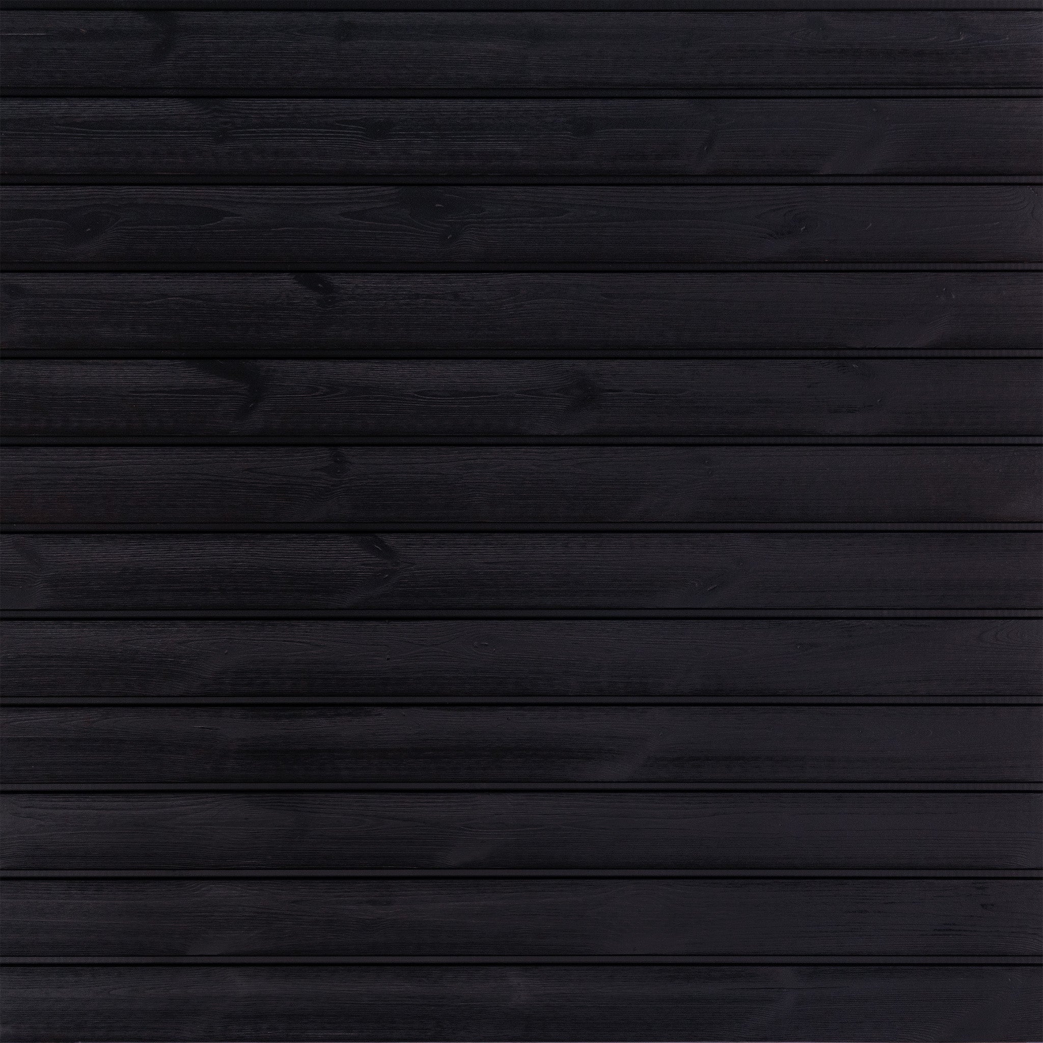 The Lunawood - Luna Pro panel by Lunawood showcases horizontal planks of dark, heat-treated wood with a smooth, uniform texture. Its rich black color highlights natural grain patterns, adding depth and elegance reminiscent of Nordic spruce.