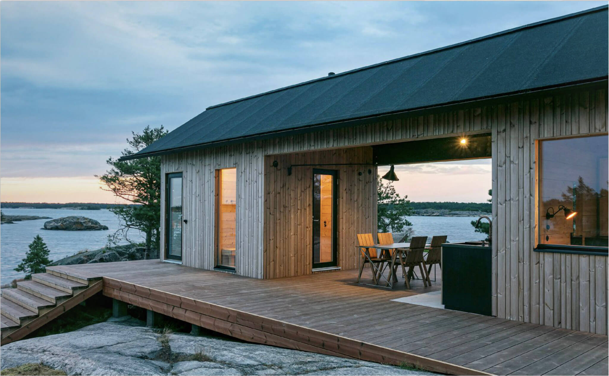 Lunawood ThermoWood decking  example - cottage on the lake with a sunset