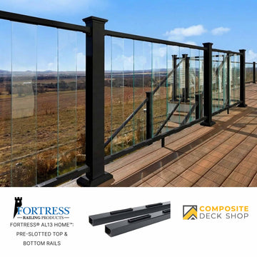 Glass railing system on a deck with a scenic view, featuring Fortress Railing Products and Composite Deck Shop logos.