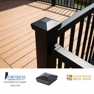 Black deck post cap on a wooden deck with Fortress Railing Products and Composite Deck Shop logos.