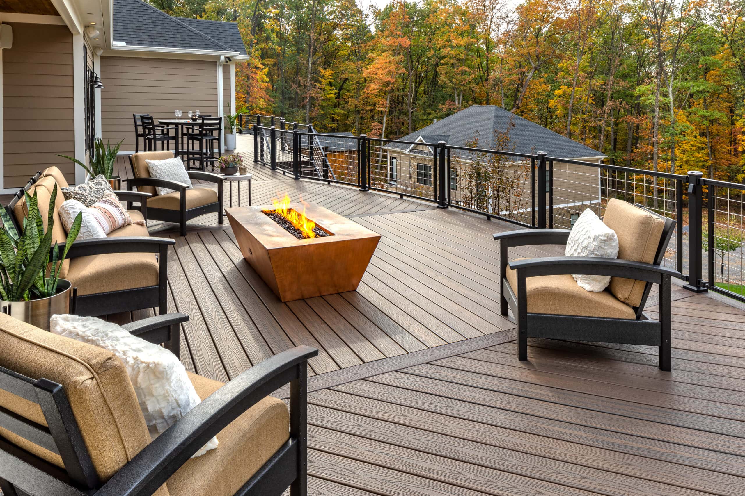 Fiberon bungalow composite deck with fireplace and couches